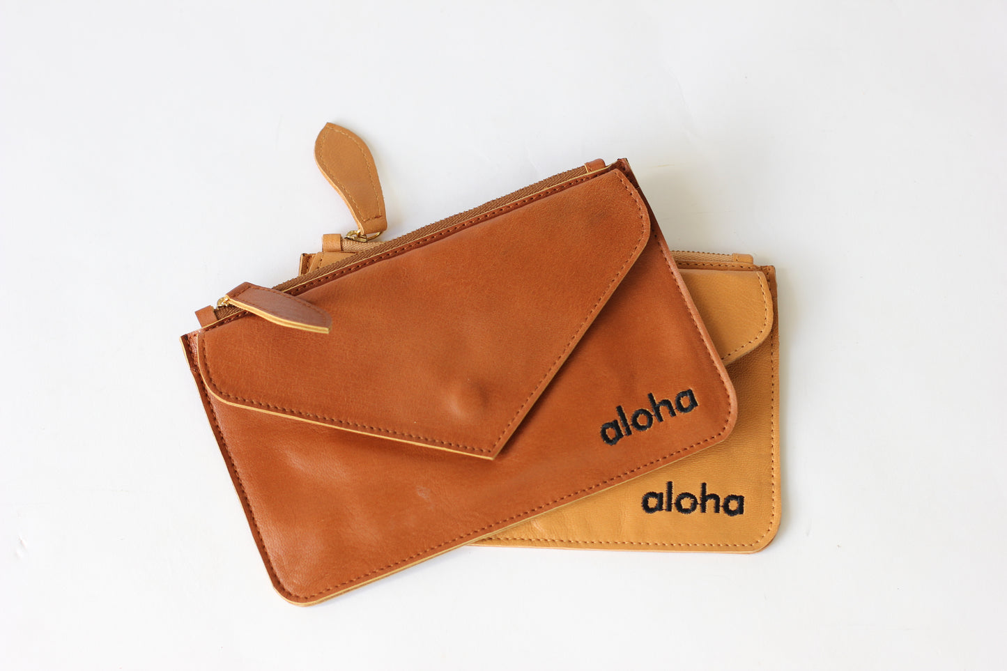 Kiki | Aloha embroidered leather mini-clutch with envelope pocket | Assorted colors