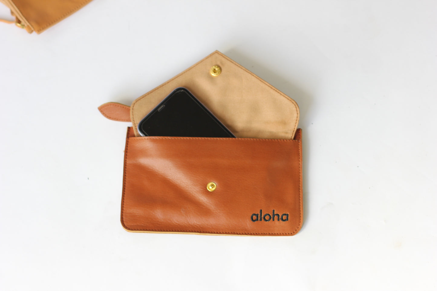 Kiki | Aloha embroidered leather mini-clutch with envelope pocket | Assorted colors